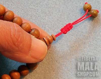 Step 1 - Adjusting Wrist Mala Beads with Tibetan Knot