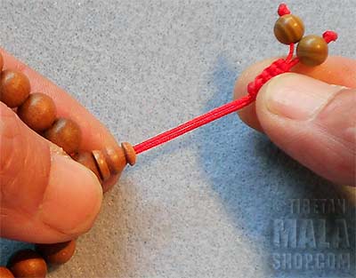 Step 2 - Adjusting Mala Bracelet with Tibetan Knot
