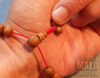 Step 5 - Adjusting Wrist Mala Beads with Tibetan Knot