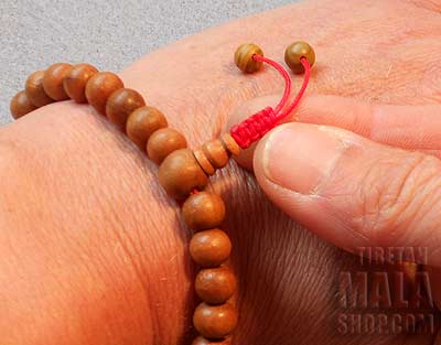 Step 7 - Adjusting Wrist Mala Beads with Tibetan Knot